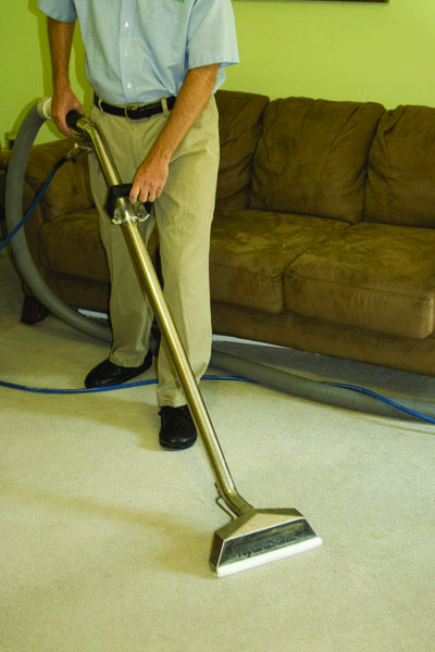 Louisville Flood Restoration hot water extraction wand in action on carpet